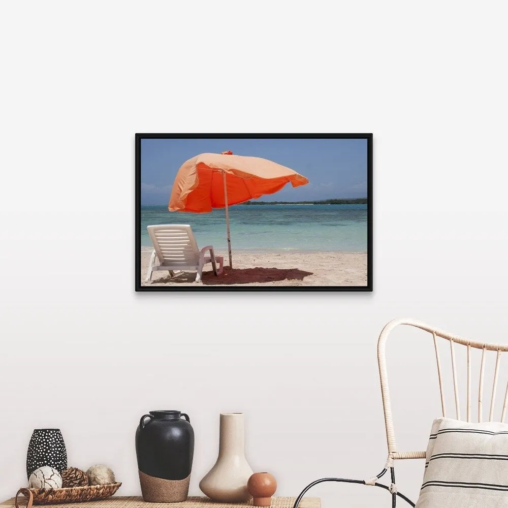 "Chair with parasol umbrella on beach" Black Float Frame Canvas Art