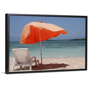 "Chair with parasol umbrella on beach" Black Float Frame Canvas Art